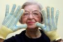 FILE - Stephanie Kwolek, 83, shown in this June 20, 2007 file photo taken in Brandywine Hundred, Del., she wears regular house gloves made with the Kevlar she invented. Her friend, Rita Vasta, told The Associated Press that Stephanie Kwolek died Wednesday in a Wilmington hospital. at age 90. (AP Photo/The News Journal, Jennifer Corbett)