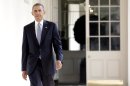 US President Barack Obama walks to the Oval Office September 10, 2013 in Washington, DC