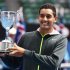 Nick Kyrgios of Australia poses with the trophy after defeating compatriot Thanasi Kokkinakis in their junior boys' singles final match at the Australian Open tennis tournament in Melbourne