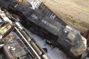 Two freight trains that collided at a rail intersection, collapsing an overpass in Missouri are pictured in this photo courtesy of KFVS12