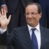 France’s President Francois Hollande, waves to the media during a joint statement with Greece's Prime Minister Antonis Samaras at the Elysee Palace, Paris, Saturday, Aug. 25, 2012. (AP Photo/Michel Euler)