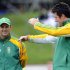 South Africa's captain Smith talks to coach Kirsten as rain delays the start of play against New Zealand in the third and final international test cricket match of the series in Wellington