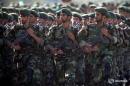 Members of Iran's Revolutionary Guards march during a military parade to commemorate the 1980-88 Iran-Iraq war in Tehran