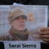 A member of the Istanbul-based Association For Families With Lost Relatives hands out flyers with photos of Sarai Sierra, a New York City woman who disappeared while on vacation in Istanbul, urging anyone with information to call police, in Istanbul, Turkey, Thursday, Jan. 31, 2013. Sierra, a 33 year-old mother of two, has been missing since Jan. 21, when she was due to return home. Turkish police have set up a special unit to search for her and are trying to trace a man she had been in contact with during her stay.(AP Photo)