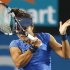 Li Na of China hits a return to Keys of the U.S. during their women's singles match at the Sydney International tennis tournament