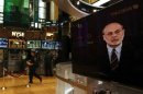 A press conference by Federal Reserve Chairman Ben Bernanke is seen on a television on the floor of the New York Stock Exchange