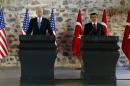 Turkish Prime Minister Davutoglu speaks during a joint news conference with U.S. Vice President Biden in Istanbul, Turkey
