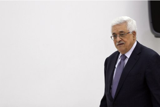 Palestinian President Mahmoud Abbas walks during a news conference in the West Bank city of Ramallah