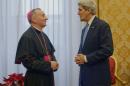 US Secretary of State John Kerry (R) speaks with Vatican Secretary of State, archbishop Pietro Parolin prior to their meeting at the Apostolic palace in the Vatican, on January 14, 2014