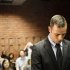 Pistorius stands in the dock during a break in court proceedings at the Pretoria Magistrates court