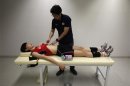 Kim of South Korea's women's national volleyball team undergoes an acupuncture session at a gym in Jincheon