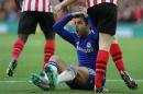 Chelsea's Cesc Fabregas holds his head after he went down following a challenge during the English Premier League soccer match between Southampton and Chelsea at St Mary's Stadium, Southampton, England, Sunday, Dec. 28, 2014. (AP Photo/Tim Ireland)