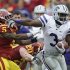 Kansas State wide receiver Chris Harper, right, tries to break a tackle by Iowa State defensive back Jeremy Reeves (5) and linebacker Jake Knott (20) during the first half of an NCAA college football game, Saturday, Oct. 13, 2012, in Ames, Iowa. (AP Photo/Charlie Neibergall)