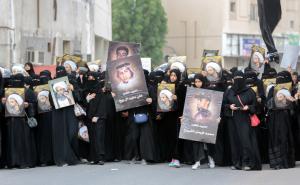 Saudi Shiite women hold signs bearing a portrait of &hellip;