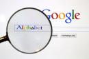File photo of a Google search page is seen through a magnifying glass in this photo illustration taken in Berlin