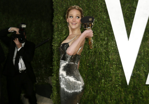 Jennifer Lawrence holds her award for Best Actress for her role in