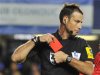 Referee Mark Clattenburg holds a red card after sending off Chelsea's Branislav Ivanovic during their English Premier League soccer match against Manchester United at Stamford Bridge in London