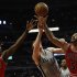 Chicago Bulls' Boozer and teammate Deng battle San Antonio Spurs' Bonner for a rebound during the first half of their NBA basketball game in Chicago