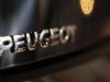 The word Peugeot is displayed on an automobile on display at a dealership in Bordeaux