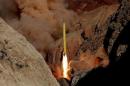 Ballistic missile is launched and tested in an undisclosed location, Iran, in this handout photo released by Farsnews
