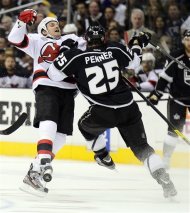 New Jersey Devils right wing David Clarkson (23) collides with Los Angeles Kings left wing Dustin Penner (25) in the first period during Game 4 of the NHL hockey Stanley Cup finals, Wednesday, June 6, 2012, in Los Angeles.  (AP Photo/Mark J. Terrill)