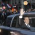 Outgoing French President Nicolas Sarkozy waves from his car as he leaves after addressing supporters at his Union for a Popular Movement (UMP) party headquarters after the the preliminary results of the second round of the presidential elections were announced in Paris Sunday May 6, 2012. Socialist Francois Hollande defeated Sarkozy on Sunday to become France's next president,  Sarkozy conceded defeat minutes after the polls closed. (AP Photo/Thibault Camus)
