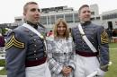 U.S. Military Academy graduates Michael Lesmeister, left, and his brother Jeffrey Daniel Lesmeister, of Anoka, Minn. stand with their mother Lynn Sheree Lesmeister after a graduation and commissioning ceremony, Wednesday, May 28, 2014, in West Point, N.Y. (AP Photo/Mike Groll)