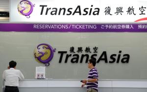 Journalists wait in front of a TransAsia reservations&nbsp;&hellip;