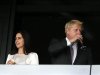 London mayor Johnson sips wine as his wife Marina stands to his left in the VIP box before the opening ceremony of the London 2012 Olympic Games