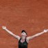 Sharapova of Russia reacts after winning her women's singles final match against Errani of Italy at the French Open tennis tournament at the Roland Garros stadium in Paris