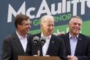 Vice President Joe Biden, center, accompanied by Sen. Mark Warner, D-Va., left, speaks at a campaign event for Virginia Democratic gubernatorial candidate Terry McAuliffe, right, Monday, Nov. 4, 2013, in Annandale, Va. On Tuesday, Virginia voters go to the polls to choose between McAuliffe and Ken Cuccinelli for the next governor. (AP Photo/Jacquelyn Martin)