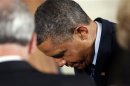 Obama prays at the Easter Prayer Breakfast in Washington