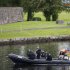 Police patrol the water around the G8 summit venue in Enniskillen, Northern Ireland on Sunday, June 16, 2013. In a two-day meeting, beginning on Monday, global leaders will discuss the economy and exchange views on foreign affairs and security issues. (AP Photo/Lefteris Pitarakis)