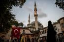 A Turkish national flag is seen on Eyup Sultan mosque on July 26, 2016 in Eyup district in Istanbul, following the failed military coup attempt of July 15