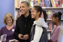 U.S. President Barack Obama and his daughters Malia and Sasha visit One More Page bookstore in Arlington