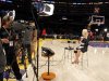 YES Network sports reporter Kustok talks on the court before the Los Angeles Lakers play against the Brooklyn Nets in a NBA basketball game in Los Angeles