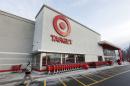 FILE - In this Dec. 19, 2013 file photo, a passer-by walks near an entrance to a Target retail store in Watertown, Mass. Target on Friday, Dec. 27, 2013 said that customers' encrypted PIN data was removed during the data breach that occurred earlier this month. But the company says it believes the PIN numbers are still safe because the information was strongly encrypted. (AP Photo/Steven Senne, File)