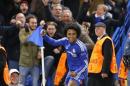 Chelsea's Willian celebrates scoring a goal during the Champions League group G soccer match between Chelsea and FC Porto at Stamford Bridge stadium in London, Wednesday, Dec. 9, 2015.(AP Photo/Frank Augstein)