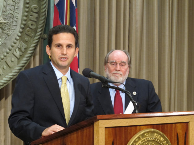 Hawaii Lt. Gov. Brian Schatz speaks the state Capitol in Honolulu on Wednesday, Dec. 26. 2012 after Gov. Neil Abercrombie, right, announced he was appointing Schatz to fill the seat vacated by the late U.S. Sen. Daniel Inouye. (AP Photo/Audrey McAvoy)