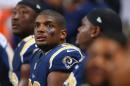 Michael Sam watches from the bench during the second half of a pre-season game between the St. Louis Rams and the New Orleans Saints, on August 8, 2013