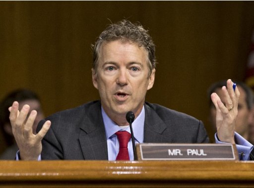 In this May 21, 2013, photo, Sen. Rand Paul, R-Ky., expresses his displeasure that Apple CEO Tim Cook was being brought before the Senate Homeland Security and Governmental Affairs Permanent Subcommittee as the panel examines the methods employed by multinational corporations to shift profits offshore and how such activities are affected by the Internal Revenue Code, on Capitol Hill in Washington. A long-simmering feud in the Senate between establishment Republicans and tea partyers breaks into full view, with Sen. John McCain accusing younger colleagues of overplaying their hands and tempting Democrats to change Senate rules that protect the minority party. How to deal with the budget and debt become the latest quarrel in a string of them between McCain _ sometimes joined by other traditionalist Republicans _ and brash, tea party-champions such as Ted Cruz of Texas, Paul and Mike Lee of Utah.  (AP Photo/J. Scott Applewhite, File)
