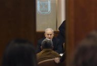 Israel's Prime Minister Benjamin Netanyahu sits across from Defence Minister Ehud Barak during the weekly cabinet meeting in Jerusalem March 11, 2012. REUTERS/Ronen Zvulun
