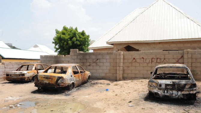 Burnt-out cars following an attack in Tudunwada district, Mubi in the northeastern Nigeria state of Adamawa on October 5, 2012
