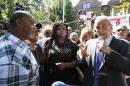 Minnesota plGov. Mark Dayton speaks with Diamond Reynolds the girlfriend of Philandro Castile, second from left, during a press conference at his residence regarding the death of Philando Castile in St. Paul, Minn., Thursday, July 7, 2016. Also at left is Clarence Castile, Philando's uncle, and Nekima Levy-Pounds, center. Philando Castile was shot in a car Wednesday night by police in the St. Paul suburb of Falcon Heights. (Leila Navidi/Star Tribune via AP)