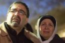 Namee Barakat and his wife Layla Barakat, parents of shooting victim Deah Shaddy Barakat, react as a video is played during a vigil in Chapel Hill