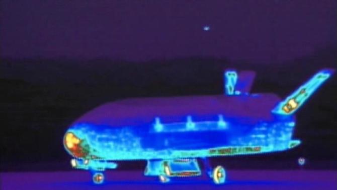 This June 16, 2012 file image from video made available by the Vandenberg Air Force Base shows an infrared view of the X-37B unmanned spacecraft landing at Vandenberg Air Force Base.  The purpose of the U.S. military&#39;s space plane is classified, only fueling speculation about why it has been orbiting Earth for nearly two years on this, its third mission. The plane is expected to land this week at a Southern California Air Force base.(AP Photo/Vandenberg Air Force Base, File)