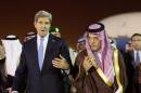 U.S. Secretary of State John Kerry, left, is escorted by Saudi Foreign Minister Prince Saud Al-Faisal bin Abdulaziz al-Saud, as Kerry arrives in Riyadh, Saudi Arabia, Sunday, Nov. 3, 2013. (AP Photo / Jason Reed, Pool)
