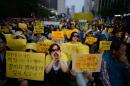 People shout slogans at a rally in Seoul on May 24, 2014 prior to a vigil for victims of the Sewol ferry disaster