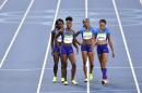 United States 4x100-meter relay team Morolake Akinosun, left, Allyson Felix, right, Tianna Bartoletta and English Gardner, third left, smile after a women's 4x100-meter relay rerun during the athletics competitions of the 2016 Summer Olympics at the Olympic stadium in Rio de Janeiro, Brazil, Thursday, Aug. 18, 2016. (AP Photo/Martin Meissner)