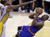 New York Knicks guard Raymond Felton, right, shoots under Indiana Pacers forward Paul George during the third quarter of Game 6 of the Eastern Conference semifinal NBA basketball playoff series in Indianapolis, Saturday, May 18, 2013. (AP Photo/Michael Conroy)